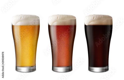 Fotografía Three Glasses of Light Beer and Dark Beer isolate white background with copy spa