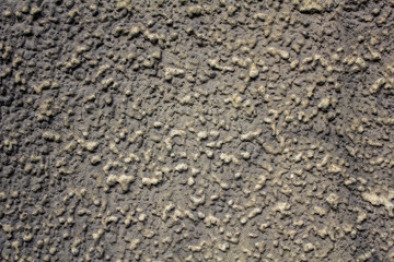 gray concrete wall with coarse-grained. rough surface texture