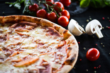 tasty italian pizza with prosciutto & cheese