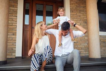 Wall Mural - Child on fathers shoulders sitting