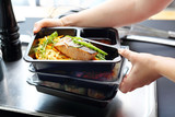 Fototapeta  - Catering. Appetizing lunch boxes. Food delivered to your doorstep