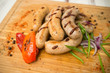 sausages for frying. fried sausages with vegetables