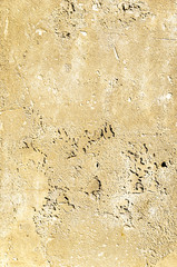 Urban concrete wall background with grooves and bubbles. Cement gray wall. Urban and industrialization art concept. Texture like concrete, stone, cement, plaster.. Poster mockup. Сloseup studio shot.