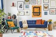 Green armchair next to blue settee in colorful living room inter