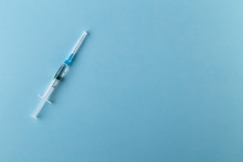 Syringe On A Blue Background