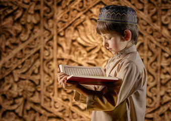 Muslim Boy Reading Holy Islamic Book Quran