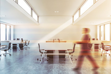 Wall Mural - Man walking in stylish white office