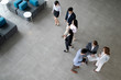 © NDABCREATIVITY - Business people planning strategy in office together