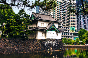 Sticker - Tokyo, Japan. Imperial Palace, Edo Castle, with guard house and moat surrounded by modern city buildings