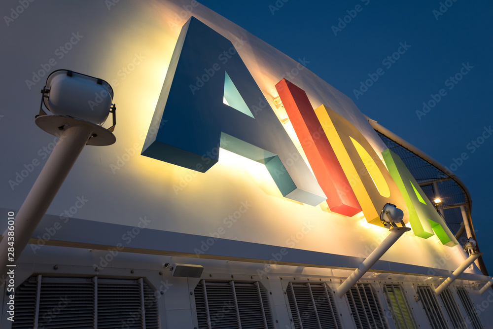ELBE, GERMANY - June 4, 2017: illuminated AIDA logo at the funnel of ...