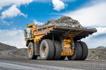 Rock transportation by dump trucks.