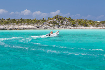 Poster - Bahamas, Exuma Island, Cays Land and Sea Park. Man and dog in skiff. Credit as: Don Paulson / Jaynes Gallery / DanitaDelimont.com