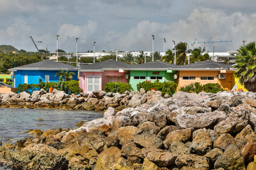 Wall Mural - Lesser Antilles, Curacao, Willemstad. Colorful shops along the pier