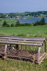 Canvas Print - Canada, Prince Edward Island. Hostetter's Overlook, view of typical fishing village, lobster trap.