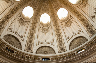 Sticker - Austria, Vienna. Cropped and low angle view of an ornately designed, domed, ceiling inside a church.