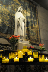 Wall Mural - France, Rhone-Alpes, Lyon. Votive candles in front of sculpture, Cathedrale Saint-Jean-Baptiste