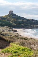 Wall Mural - Italy, Sardinia, Oristano. The Torre spangla di San Giovanni di Sinis on the top of a hill overlooking the Mediterranean sea.