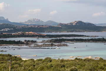 Wall Mural - Italy, Sardinia, Boat dock in the Mediterranean sea.