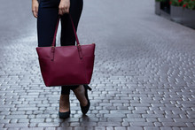Woman Holding Red Purse