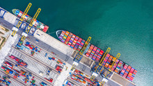 Container Cargo Ship Loading And Unloading , Aerial Top View Of Boat Business Commerce Logistic Commercial Import And Export Freight  Transportation By Container Cargo Ship In Open Sea.