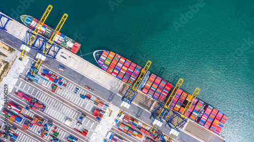 Cuadros en Lienzo Container ship loading and unloading in deep sea port, Aerial top view of business logistic import and export freight transportation by container ship in open sea