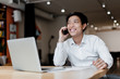 © Anastasia - asian man in the office uses laptop