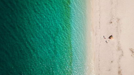 Aerial drone photo of tropical exotic island sand bar separating sea in two with turquoise and sapphire breathtaking colours