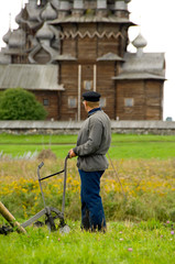 Poster - Russia, Lake Onega, Kizhi Island. UNESCO site. Traditional horse plow in front of the historic Transfiguration Church (built 1714) 