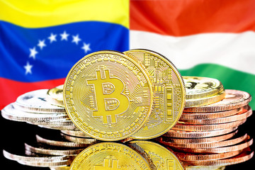 bitcoins on Venezuela and Hungary flag background