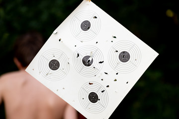 Wall Mural - A well perforated paper target.