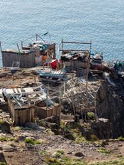 Poster - Fishing shed with nets, fishing gear and dog sled. Small town of Uummannaq, northwest Greenland.