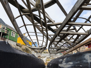 Poster - Kayak on rack belonging to the local kayak club. Small town of Uummannaq, northwest Greenland.