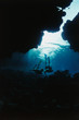 Solomon Islands, Snorkelers swimming through cave