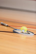 Badminton Racquet and Shuttlecock on Gym Floor