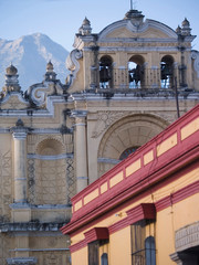 Wall Mural - Antigua, Guatemala. Lamps in the colonial arched doorways near the town square at twilight.