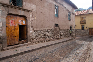 Poster - South America - Peru. Old Inca wall foundation along cobblestone street in Cusco.