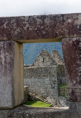 Poster - South America - Peru. View through trapezoidal window of stonework in the lost Inca city of Machu Picchu.