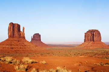 Poster - USA, AZ, Navajo Reservation, Merrick Butte and the Mittens in Monument Valley Tribal Park at Sunset