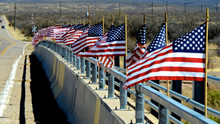 American Flags Line A Bridge In Rural Arizona.