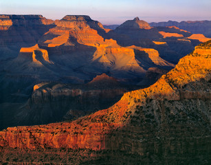 Sticker - USA, Arizona, Grand Canyon NP. Just the tops of the mesas are lit at sunset at the Grand Canyon National Park, a World Heritage Site, Arizona.