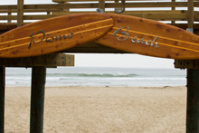USA, CA, Pismo Beach. Vintage Wooden Surfboards Frame Entrance To Inviting Beach. Clam Capital, Surfing