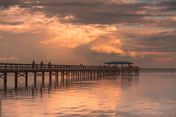 Wall Mural - Fishing pier off Safety Harbor, Florida. Sunset with people fishing