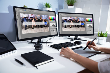 Wall Mural - Female Editor Working On Computer