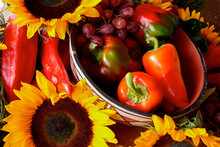 Santa Fe, New Mexico, United States. Display Of Red Peppers And Sunflowers