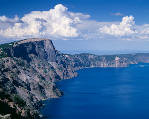 Wall Mural - USA, Oregon, Crater Lake National Park. Thunder clouds float over Llao Rock (left) and north rim of Crater Lake.