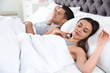© New Africa - Portrait of lovely couple sleeping in large bed