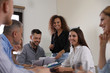 © New Africa - Portrait of volunteers having meeting in office