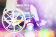 Beautiful effect blurry image of disable person sit on wheelchair with bright and colorful bokeh of light for fight hope and move on background with vital sign.