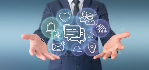 Businessman holding a cloud of social media network icon