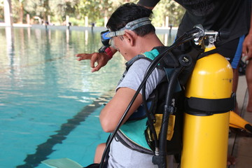 A group of people doing diving training in a swimming pool in Batang / Central Java, Indonesia, August 14, 2019